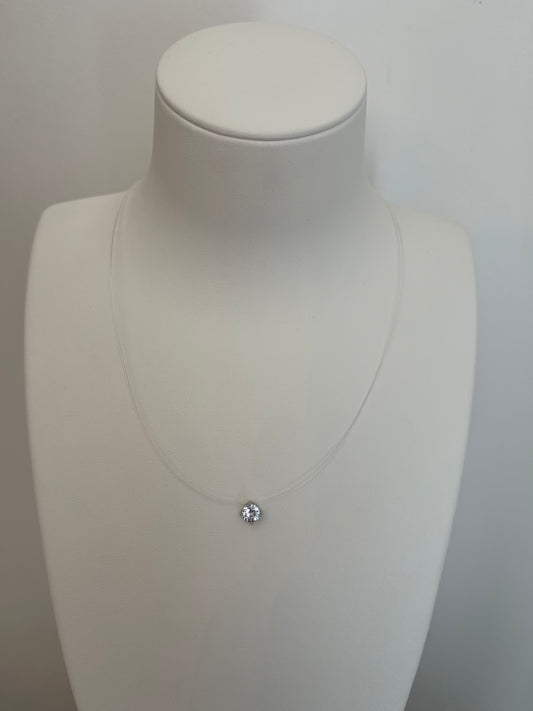 ✨ Collier solitaire sur fil transparent - Effet suspendu argenté
